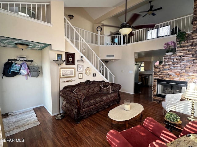 11048 Nathan Bay Dr, El Paso, TX 79934 - living room featuring ceiling fan, high vaulted ceiling, wood finished floors, stairs, and a fireplace