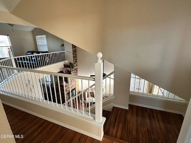 11048 Nathan Bay Dr, El Paso, TX 79934 - stairs featuring wood finished floors, baseboards, and healthy amount of natural light
