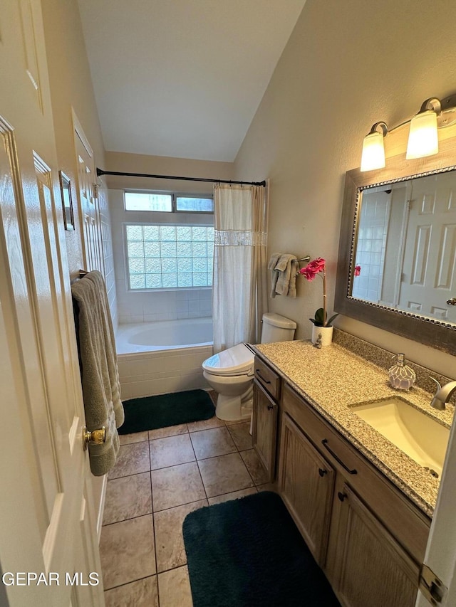 11048 Nathan Bay Dr, El Paso, TX 79934 - full bathroom featuring vaulted ceiling, toilet, vanity, tiled shower / bath, and tile patterned flooring