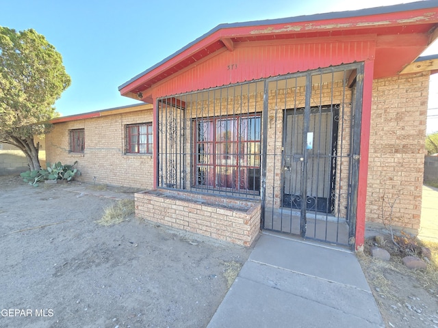 371 Medina St, El Paso, TX 79905 - property entrance featuring brick siding