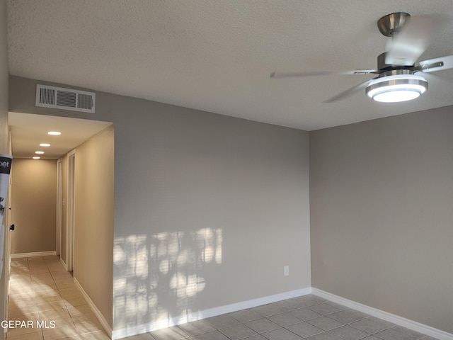 338 Maricela Dr, El Paso, TX 79915 - unfurnished room featuring light tile patterned flooring, ceiling fan, and a textured ceiling