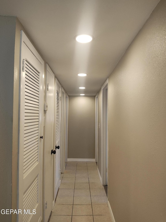 338 Maricela Dr, El Paso, TX 79915 - hall featuring light tile patterned floors and baseboards