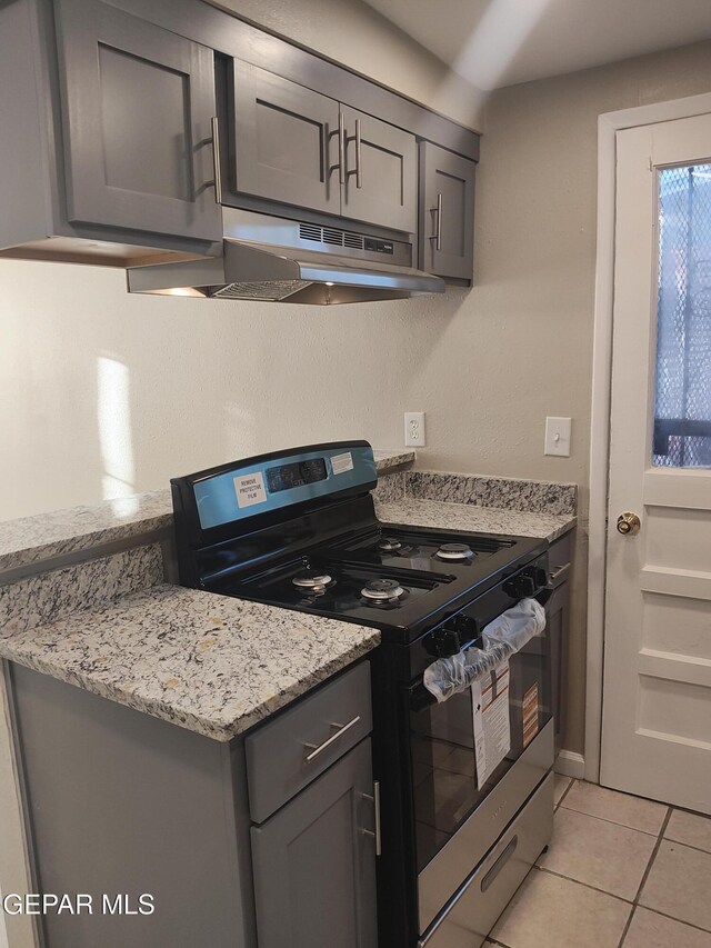 338 Maricela Dr, El Paso, TX 79915 - kitchen featuring electric stove, gray cabinetry, under cabinet range hood, and light tile patterned floors