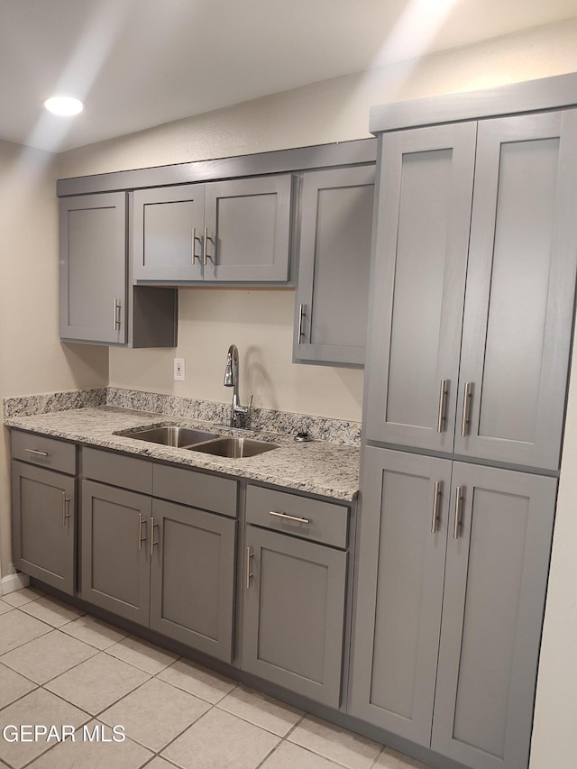 338 Maricela Dr, El Paso, TX 79915 - kitchen featuring gray cabinets, a sink, light tile patterned floors, and light countertops