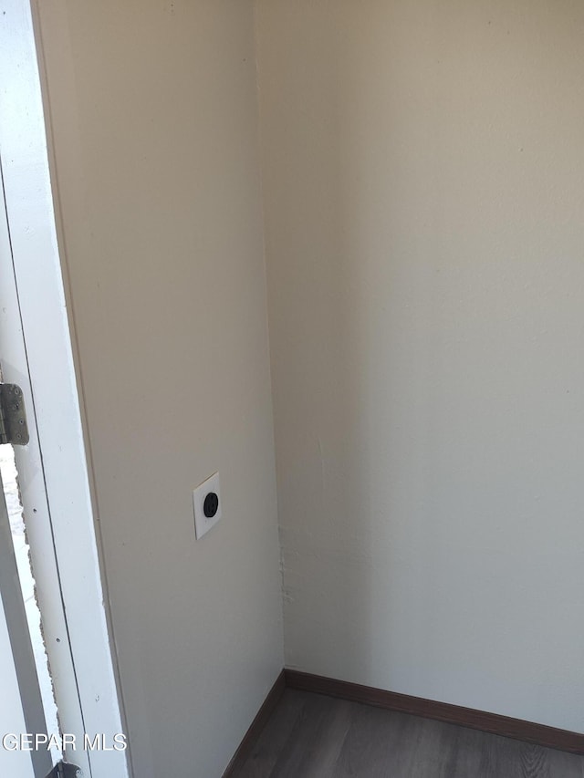 338 Maricela Dr, El Paso, TX 79915 - washroom featuring hookup for an electric dryer, baseboards, and dark wood-style flooring