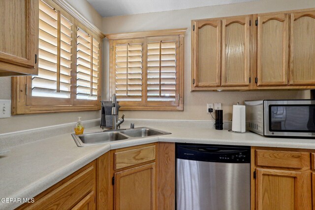 14025 Stoutland Ln, El Paso, TX 79928 - kitchen featuring stainless steel appliances, a sink, healthy amount of natural light, and light countertops