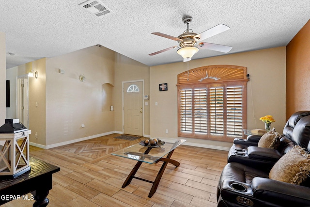 14025 Stoutland Ln, El Paso, TX 79928 - living room featuring ceiling fan, baseboards, light wood finished floors, a textured ceiling, and lofted ceiling