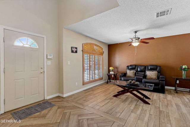 14025 Stoutland Ln, El Paso, TX 79928 - foyer featuring ceiling fan, baseboards, and a textured ceiling