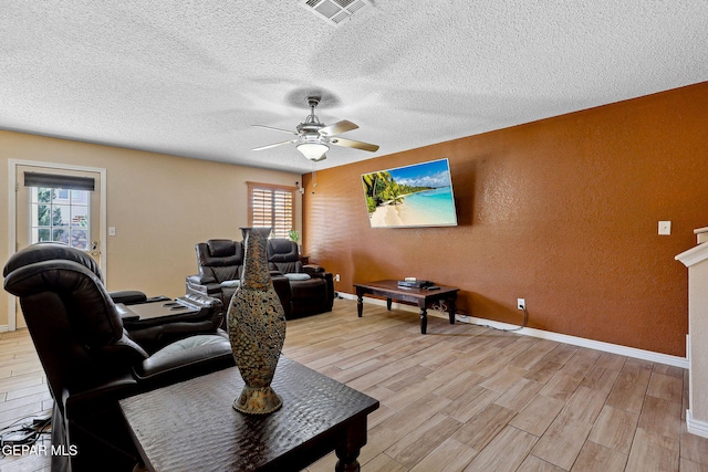 14025 Stoutland Ln, El Paso, TX 79928 - office area featuring a ceiling fan, a textured wall, healthy amount of natural light, light wood-type flooring, and a textured ceiling