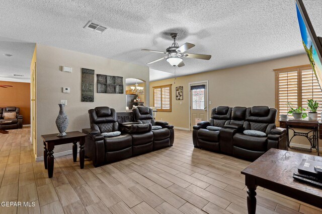 14025 Stoutland Ln, El Paso, TX 79928 - living area featuring a ceiling fan, light wood finished floors, and a textured ceiling