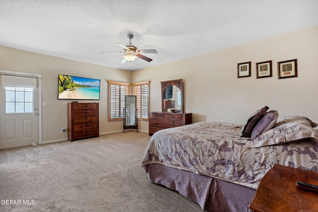 14025 Stoutland Ln, El Paso, TX 79928 - bedroom featuring light colored carpet, baseboards, a textured ceiling, and ceiling fan