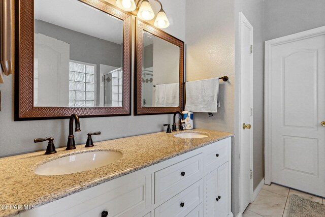 14025 Stoutland Ln, El Paso, TX 79928 - full bath featuring double vanity, tile patterned flooring, and a shower
