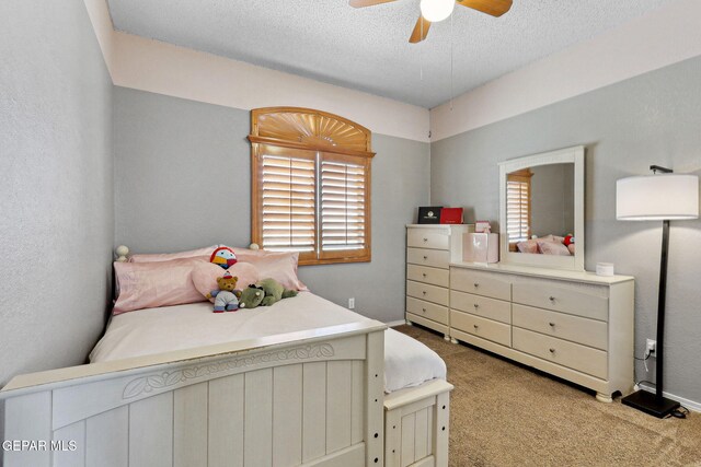 14025 Stoutland Ln, El Paso, TX 79928 - carpeted bedroom with a textured ceiling and a ceiling fan
