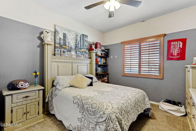14025 Stoutland Ln, El Paso, TX 79928 - carpeted bedroom with baseboards, ceiling fan, and a textured ceiling