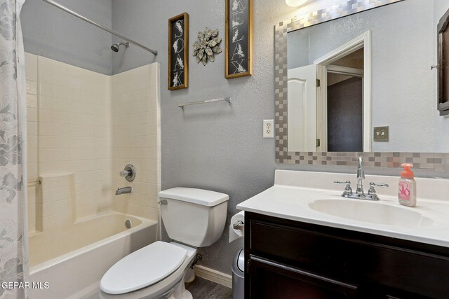14025 Stoutland Ln, El Paso, TX 79928 - bathroom featuring shower / tub combo, toilet, vanity, and baseboards