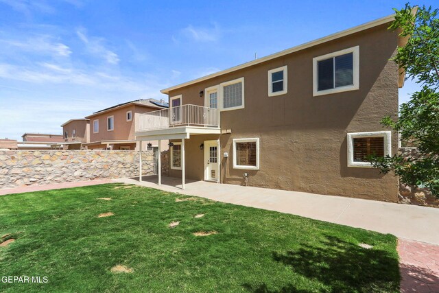 14025 Stoutland Ln, El Paso, TX 79928 - back of house with a balcony, stucco siding, and a patio area