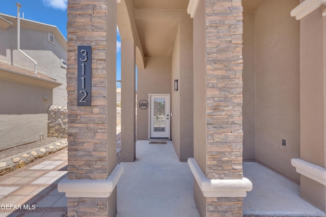3112 Java Chip Pl, El Paso, TX 79938 - doorway to property with stone siding and stucco siding