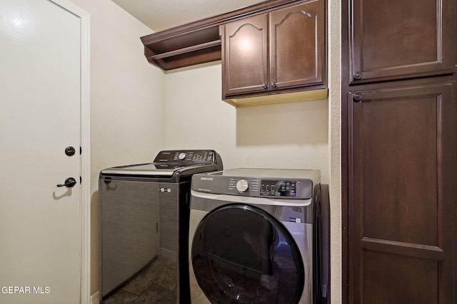 14309 Coyote Trl, El Paso, TX 79938 - laundry area featuring washer and clothes dryer and cabinet space