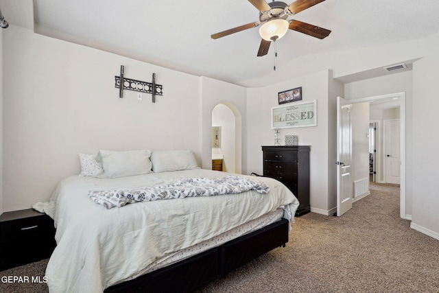 14309 Coyote Trl, El Paso, TX 79938 - carpeted bedroom with baseboards, arched walkways, and ceiling fan