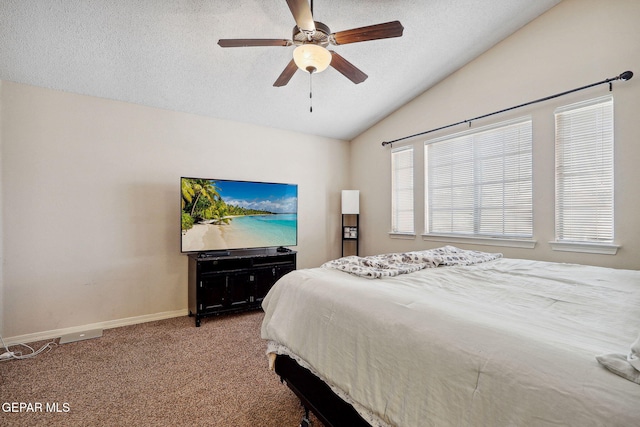 14309 Coyote Trl, El Paso, TX 79938 - bedroom featuring lofted ceiling, a textured ceiling, baseboards, carpet floors, and ceiling fan
