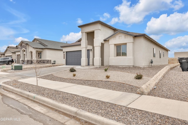 13688 Lago Vista Ave, El Paso, TX 79928 - view of front of property with a garage, concrete driveway, and stucco siding