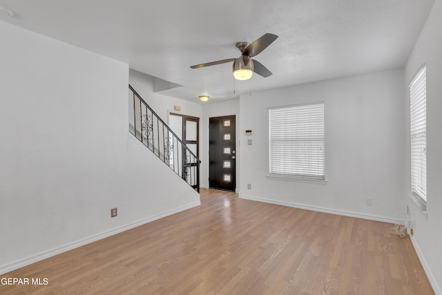 5424 Fire Ridge Cir, El Paso, TX 79932 - foyer entrance with a ceiling fan, stairs, wood finished floors, baseboards, and healthy amount of natural light