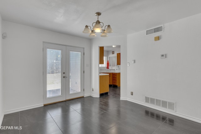 5424 Fire Ridge Cir, El Paso, TX 79932 - unfurnished dining area featuring french doors, a chandelier, plenty of natural light, and baseboards