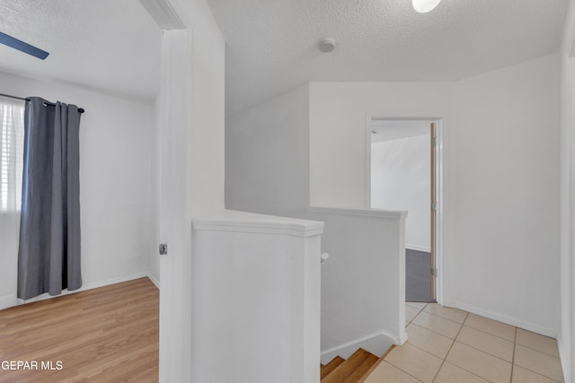 5424 Fire Ridge Cir, El Paso, TX 79932 - bonus room featuring a textured ceiling, baseboards, and light tile patterned flooring