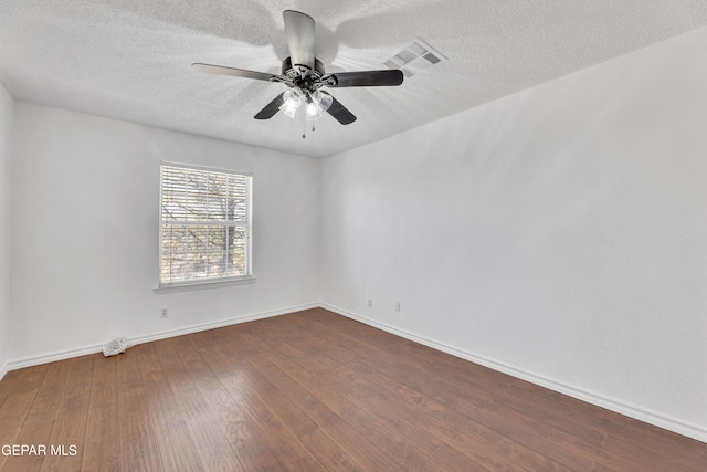 5424 Fire Ridge Cir, El Paso, TX 79932 - spare room featuring dark wood finished floors, a textured ceiling, a ceiling fan, and baseboards
