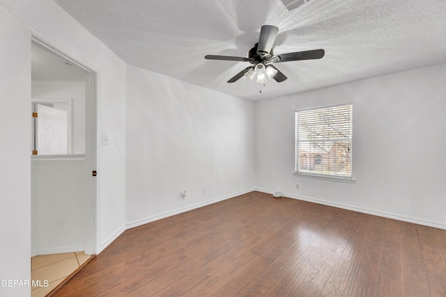 5424 Fire Ridge Cir, El Paso, TX 79932 - empty room featuring ceiling fan, a textured ceiling, wood-type flooring, and baseboards