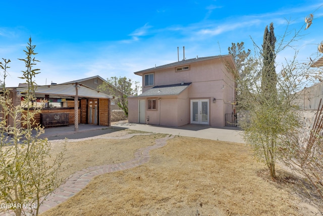 5424 Fire Ridge Cir, El Paso, TX 79932 - back of property with french doors and a patio area