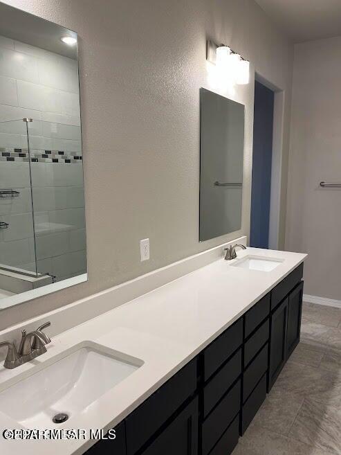 14772 John Mcneely Ave, El Paso, TX 79938 - full bath featuring double vanity and tiled shower