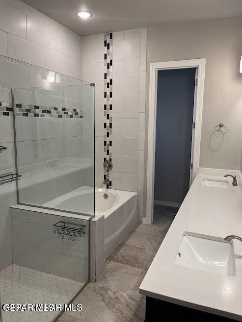 14772 John Mcneely Ave, El Paso, TX 79938 - bathroom with double vanity and bathing tub / shower combination