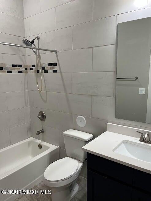 14772 John Mcneely Ave, El Paso, TX 79938 - full bath featuring vanity, toilet, and shower / washtub combination