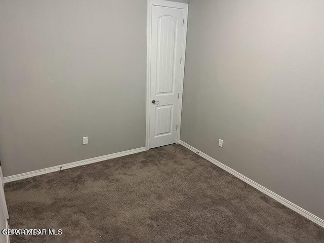 14772 John Mcneely Ave, El Paso, TX 79938 - spare room featuring dark carpet and baseboards