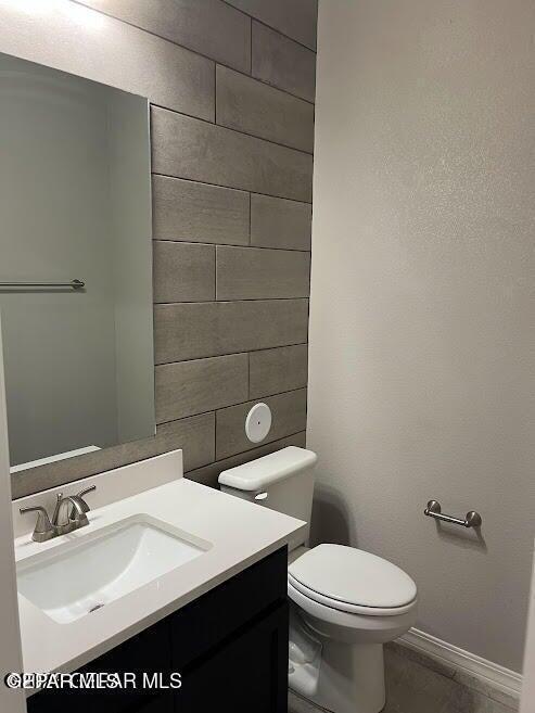 14772 John Mcneely Ave, El Paso, TX 79938 - half bath with vanity, toilet, and baseboards