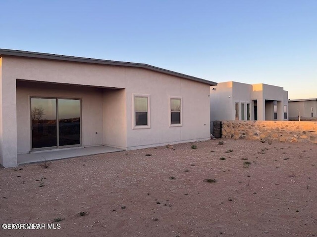 14772 John Mcneely Ave, El Paso, TX 79938 - back of property featuring stucco siding