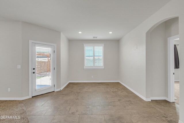 12776 Runway Ave, El Paso, TX 79928 - spare room with baseboards, recessed lighting, and arched walkways