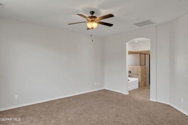 12776 Runway Ave, El Paso, TX 79928 - unfurnished room featuring carpet floors, arched walkways, a ceiling fan, and baseboards