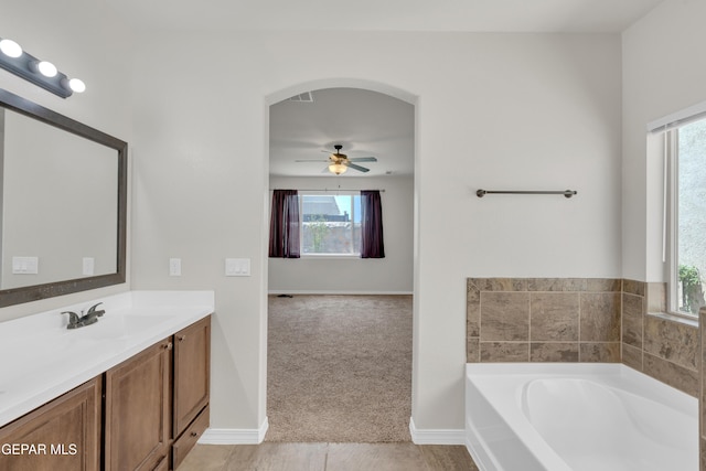 12776 Runway Ave, El Paso, TX 79928 - bathroom with a bath, vanity, ceiling fan, and baseboards