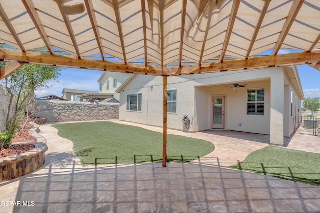 12776 Runway Ave, El Paso, TX 79928 - fenced backyard with a ceiling fan, a patio area, and a gazebo