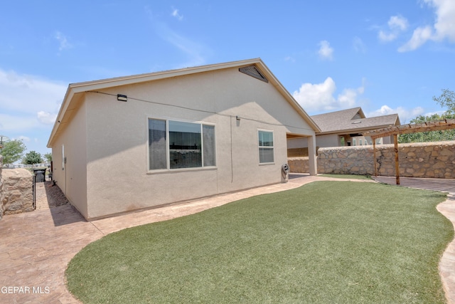 12776 Runway Ave, El Paso, TX 79928 - back of property featuring stucco siding and a patio area