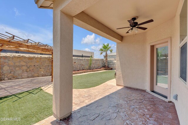 12776 Runway Ave, El Paso, TX 79928 - fenced backyard featuring a ceiling fan and a patio