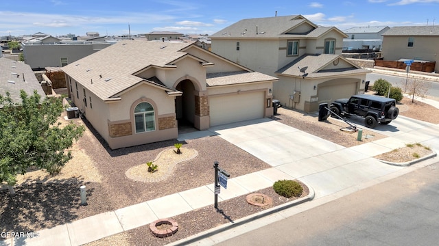 12776 Runway Ave, El Paso, TX 79928 - view of front of property with stucco siding, a garage, central AC unit, driveway, and a residential view