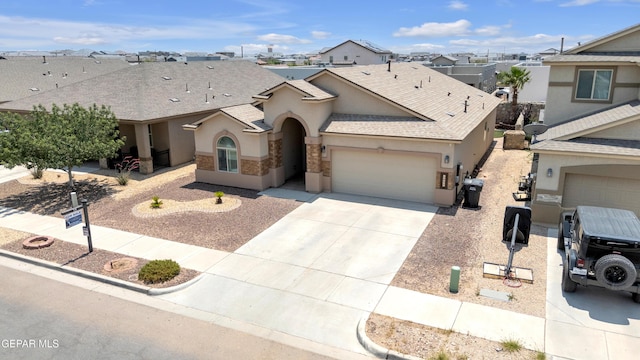 12776 Runway Ave, El Paso, TX 79928 - view of front of property featuring stucco siding, roof with shingles, a garage, driveway, and a residential view