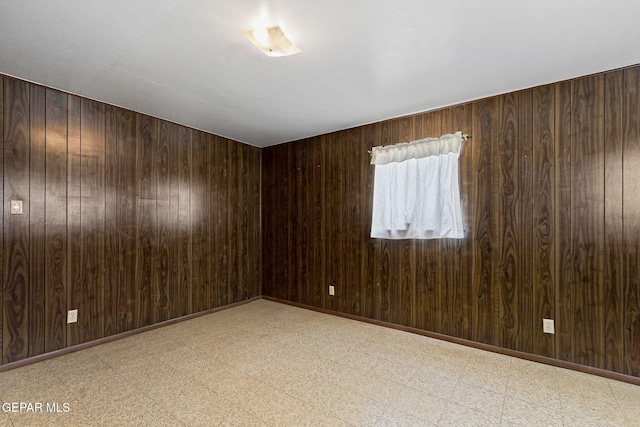 211 Green Haven Pl, El Paso, TX 79907 - empty room featuring light flooring and wooden walls