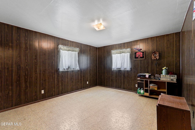 211 Green Haven Pl, El Paso, TX 79907 - home office featuring light floors and wood walls
