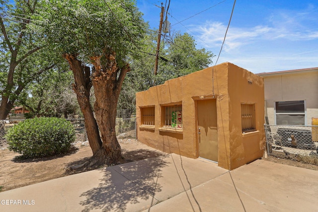 211 Green Haven Pl, El Paso, TX 79907 - view of side of property with stucco siding and a patio