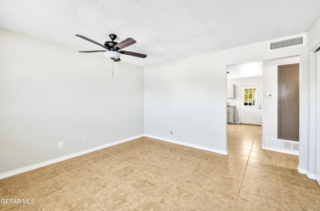 729 Delhi Dr, Socorro, TX 79927 - spare room featuring a ceiling fan, light tile patterned floors, a textured ceiling, and baseboards