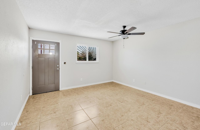 729 Delhi Dr, Socorro, TX 79927 - entryway featuring ceiling fan, light tile patterned floors, a textured ceiling, and baseboards